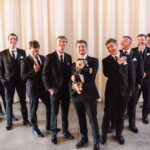 groom and groomsmen with dog